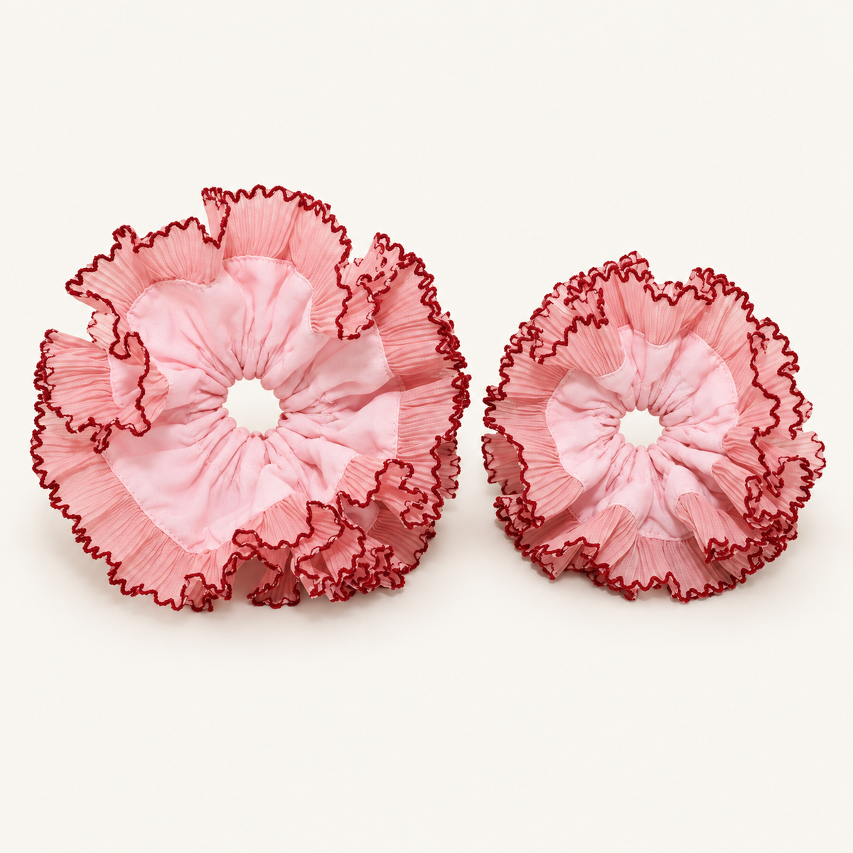 Mom and Kid scrunchies shown together — larger Mom on left, smaller Kid on right; sizes sold separately