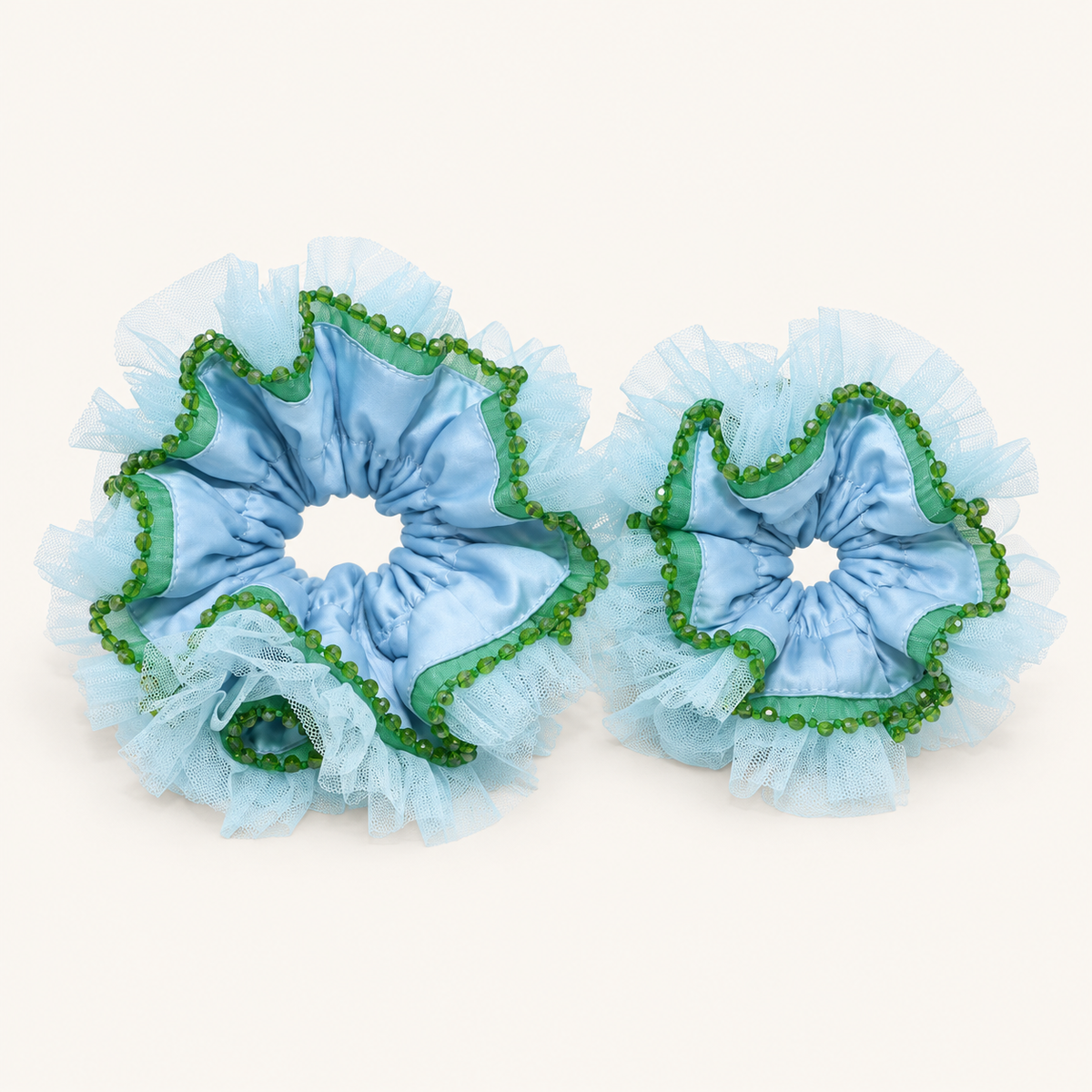 Mom and Kid scrunchies shown together — larger Mom on left, smaller Kid on right; sizes sold separately