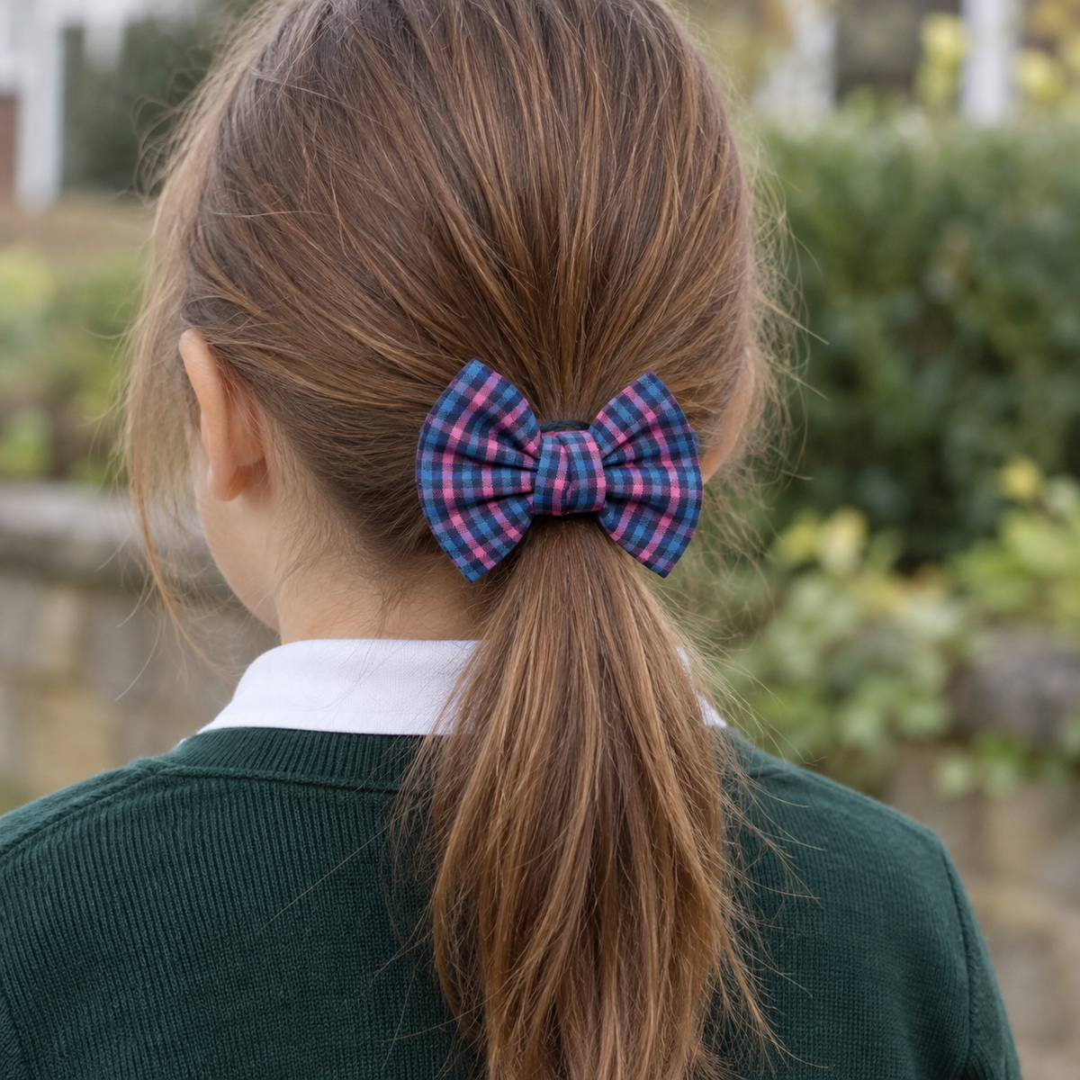 Schoolgirl Plaid Bow Hair Tie — low ponytail wearing illustration, AI-generated; scale approximate
