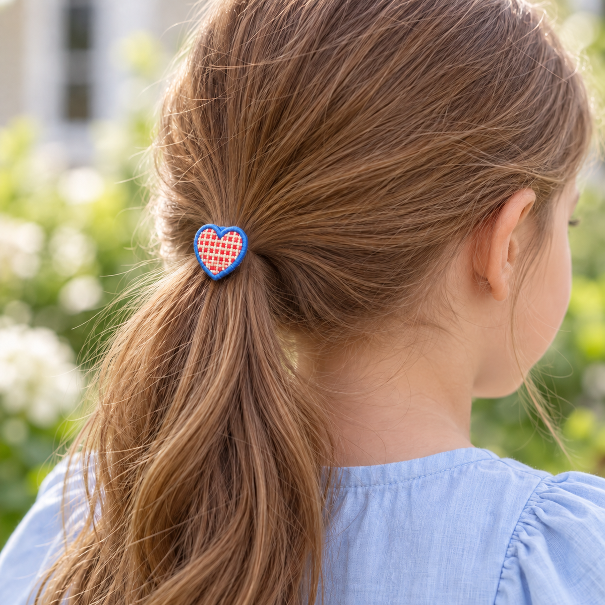 Picnic Heart Gingham Hair Tie — AI-generated wearing illustration; scale approximate